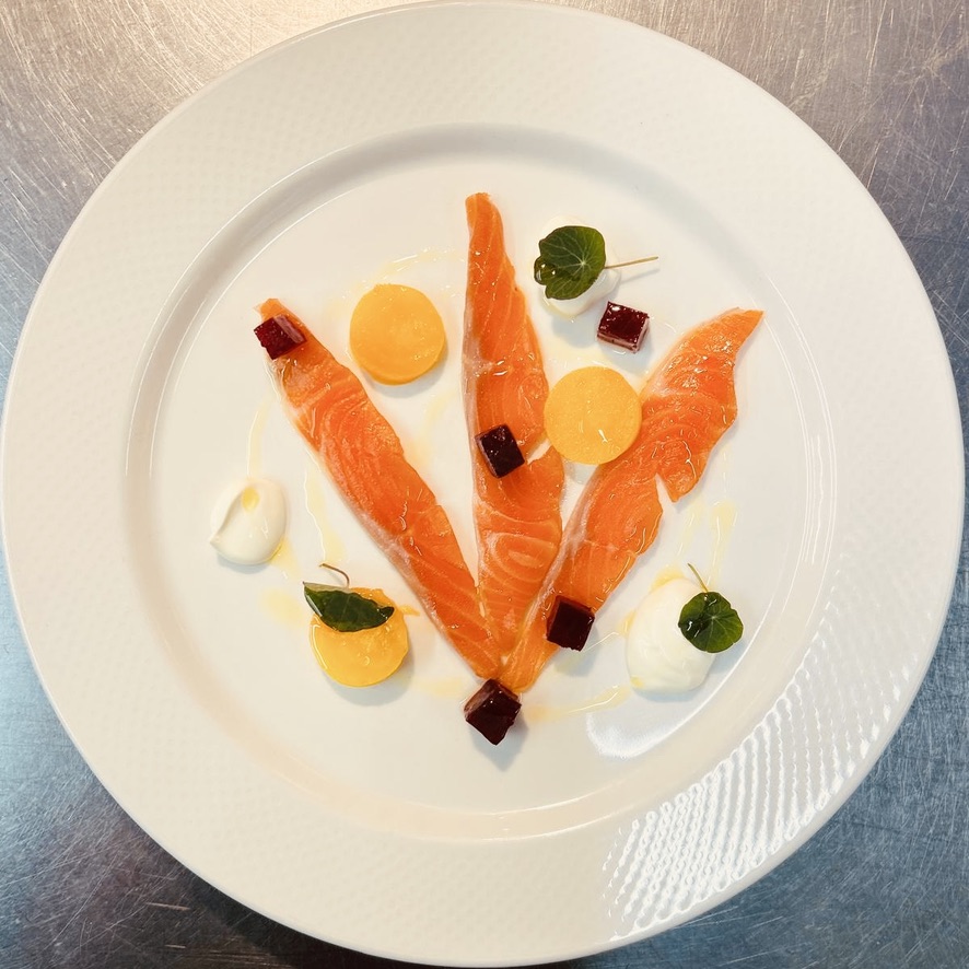 Plated fish starter with colourful garnishes at The Punch Bowl Paglesham